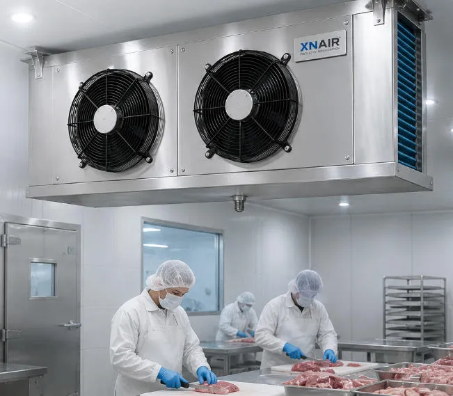 XNAIR evaporator in a food processing facility — stainless steel hygienic casing, operating at +2°C for meat processing room, easy-clean design