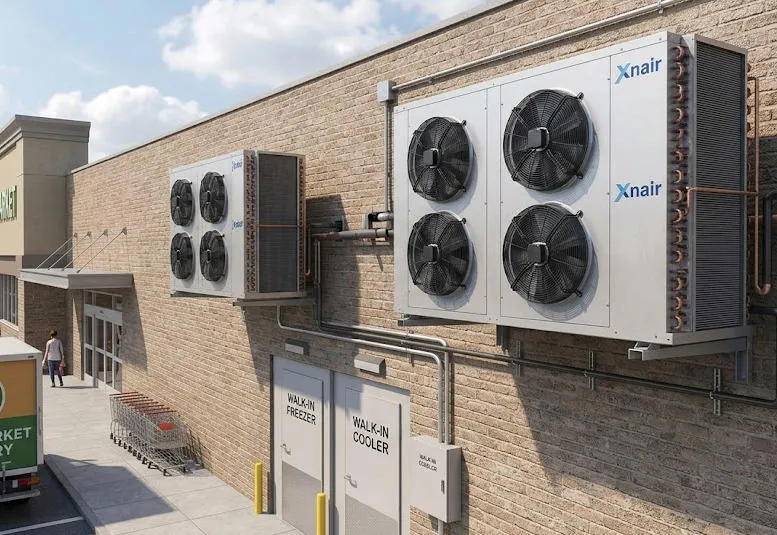 Xnair air-cooled condenser installed on exterior wall of supermarket cold storage facility serving walk-in freezer and cooler rooms