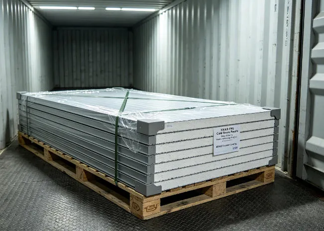 XNAIR EPS cold room panels stacked flat on fumigated plywood pallets inside a 40-foot shipping container with edge protectors and tension belt strapping for ocean freight to Africa