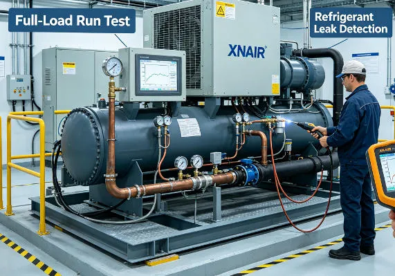 Factory quality control test bench with xnair condensing unit undergoing full-load run test, refrigerant leak detector probe, and digital performance data logger