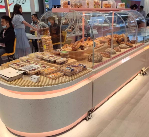 Curved glass cake display